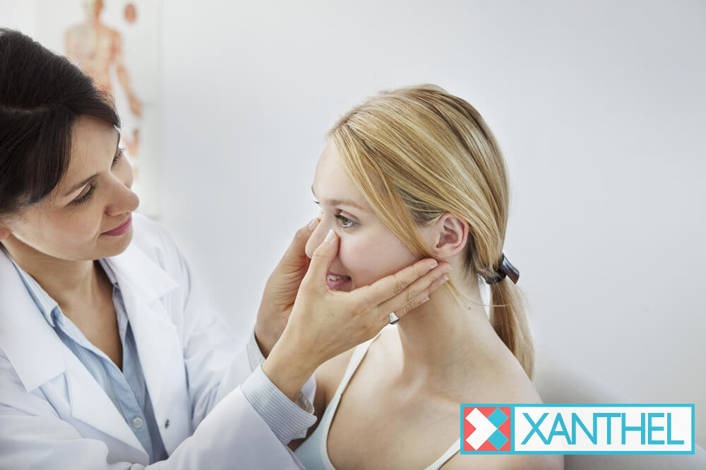 Cholesterol deposits under the skin near the eye